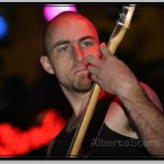 Miguel Roy Concentrating on Guitar Fretboard