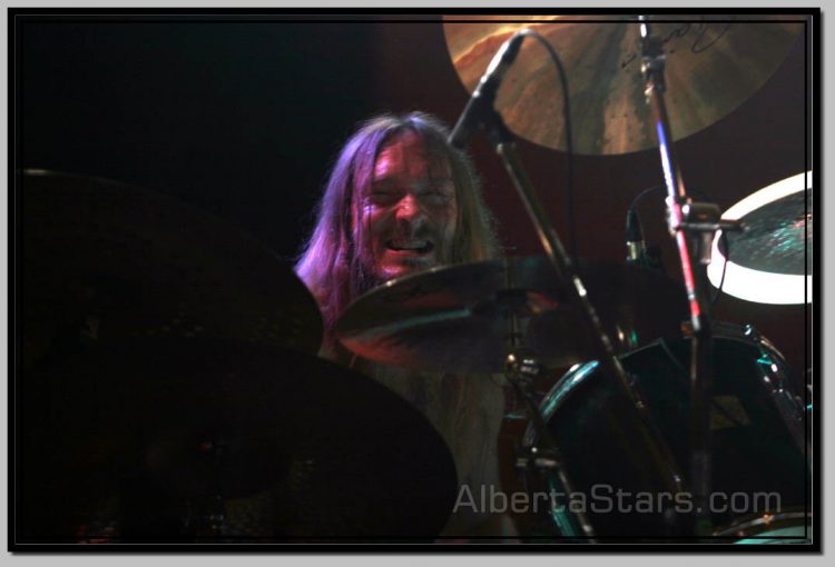 Grimace on Face of Steve Asheim WHile Playing Hard and Fast