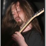 Oli Herbert Concentrating on His Fretboard