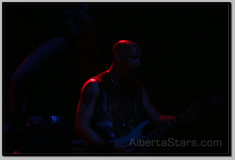 Bloodshoteye's Guitarist Under Red Spot Light