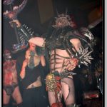 Oderus Urungus Holds Up Large Sword