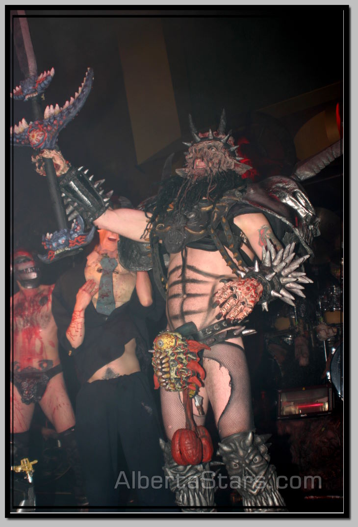 Oderus Urungus Holds Up Large Sword
