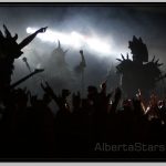 Outlines of GWAR Members Against Stage Lights