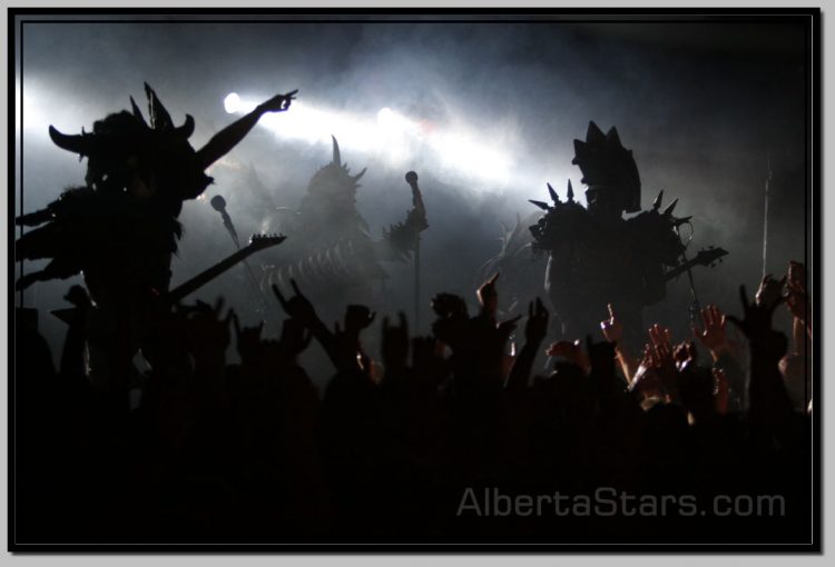 Outlines of GWAR Members Against Stage Lights