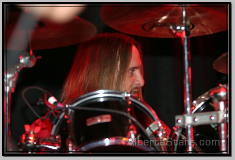 Tom Hunting Behind His Drum Set