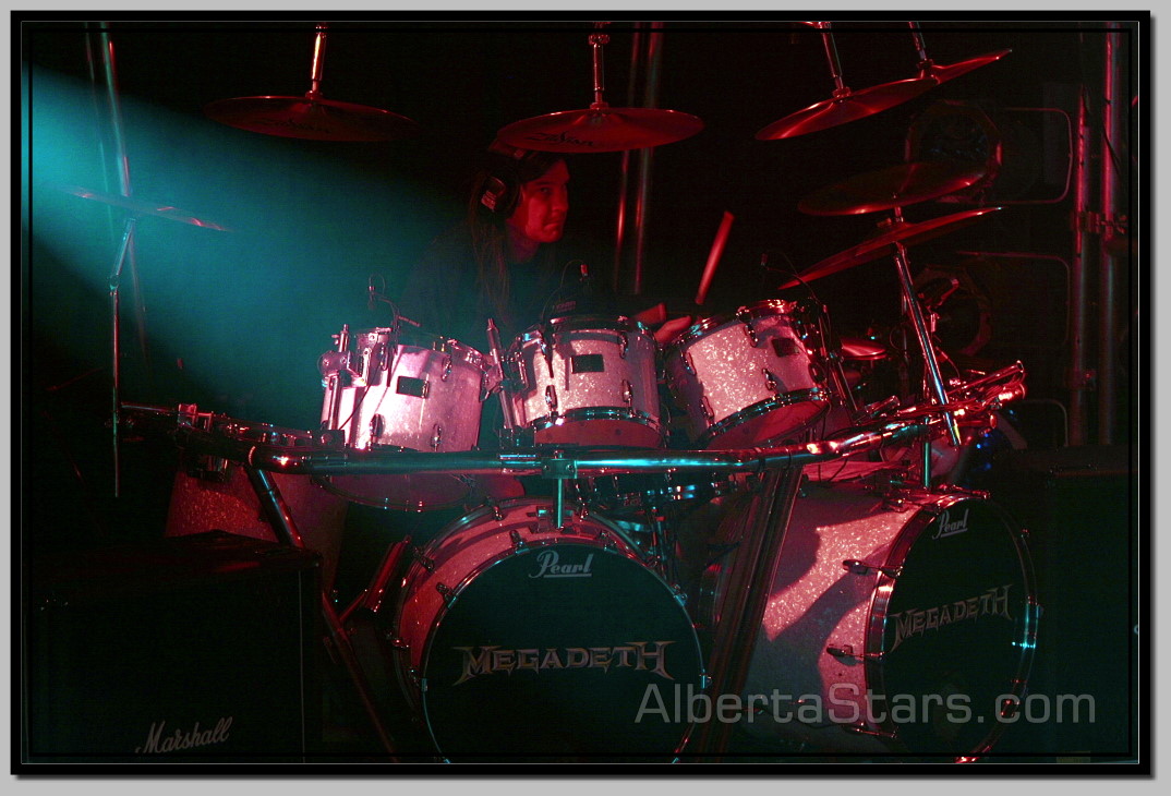Light Bean Striking Drums of Shawn Drover from Side
