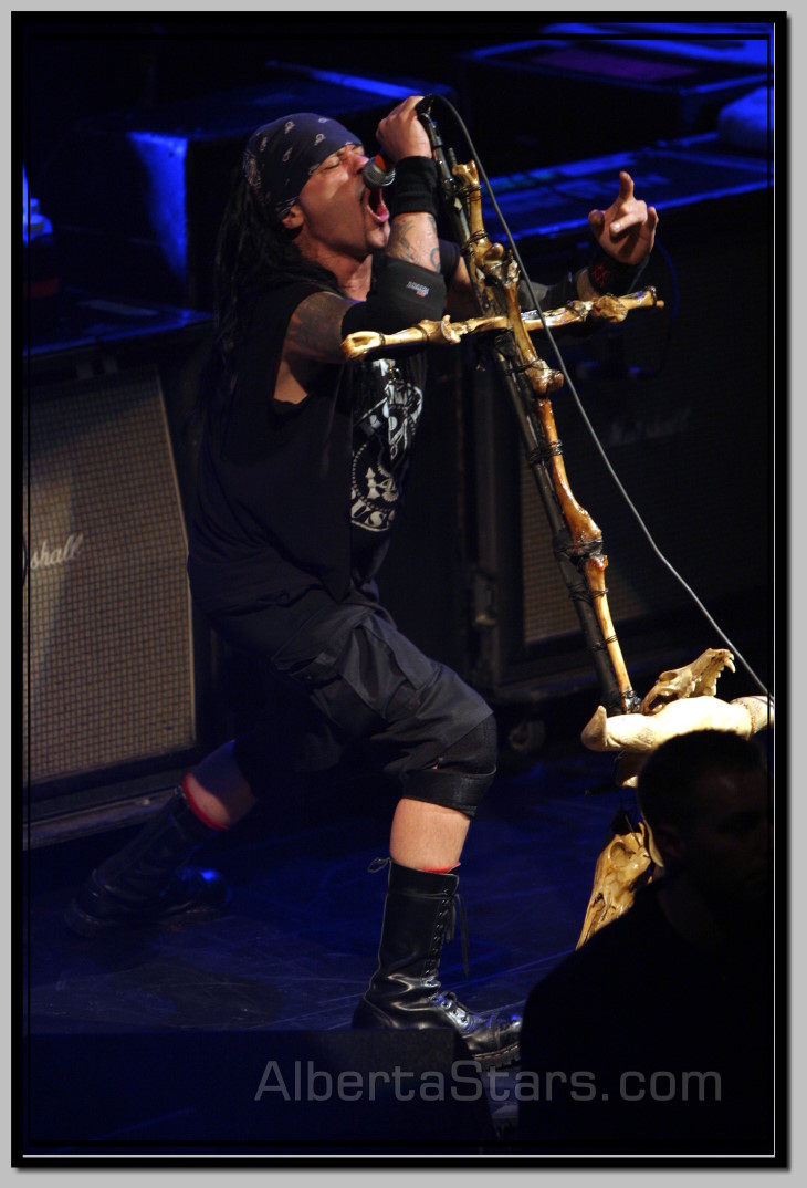 Al Jourgensen with Cross Bone Mic Stand