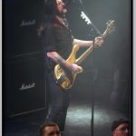 Lemmy Kilmister with Trademark High Mic Position