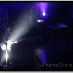 Matt Bellamy Reflecting Spotlight with His Shiny Guitar