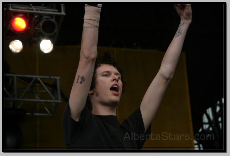 Jason McCaslin with Number of His Band Tattooed on Arm